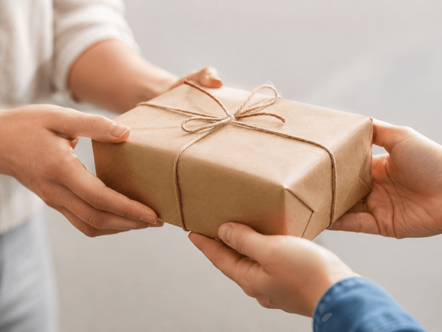 Hands receiving a delivered group buy order